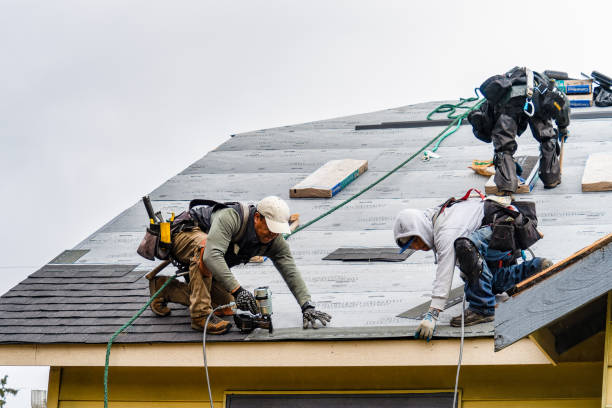Professional Gutter Installation technician working in Marlborough, MA